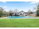 Backyard with inground pool, patio, and well-maintained lawn, perfect for outdoor entertaining at 2720 Creekview Nw Pt, Marietta, GA 30064