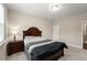 Bedroom features neutral decor, plush carpeting, and a sunny window at 380 Parkside Meadow Sw Dr, Marietta, GA 30064