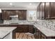 Well-equipped kitchen features granite countertops, stainless steel appliances, and a modern backsplash at 380 Parkside Meadow Sw Dr, Marietta, GA 30064