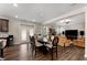 Bright living area shows an open floor plan with dark wood floors, dining area, fireplace, and comfortable seating at 380 Parkside Meadow Sw Dr, Marietta, GA 30064