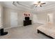 Large main bedroom features a tray ceiling, soft carpeting, and neutral tones at 380 Parkside Meadow Sw Dr, Marietta, GA 30064