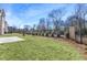 Lush backyard featuring a large grassy area and a paved patio, ideal for outdoor activities at 3909 Enclave Way, Tucker, GA 30084