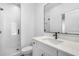 Modern bathroom featuring a white-tiled shower and sleek vanity with black hardware at 3909 Enclave Way, Tucker, GA 30084