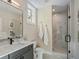 Clean bathroom featuring white vanity, toilet, and a glass-enclosed shower with marble tiling at 3909 Enclave Way, Tucker, GA 30084