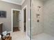 Modern bathroom showing a glass shower and a doorway leading to the toilet at 3909 Enclave Way, Tucker, GA 30084