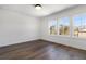 Bright bedroom with hardwood floors, large windows, and neutral paint creating a serene and inviting atmosphere at 3909 Enclave Way, Tucker, GA 30084