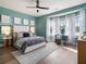 Cozy bedroom featuring bay windows and a beautifully decorated queen-sized bed at 3909 Enclave Way, Tucker, GA 30084