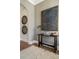 Inviting hallway with decorative wall art, an accent table, and a patterned rug at 3909 Enclave Way, Tucker, GA 30084