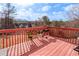 Outdoor deck with barbecue, potted plants, and railing overlooking the yard at 4283 Northwind Dr, Ellenwood, GA 30294