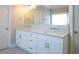 Bright bathroom featuring double sinks with white cabinets and modern fixtures at 445 Edenbrooke Way, Roswell, GA 30075