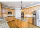 Well-lit kitchen with granite countertops, stainless steel appliances, and ample cabinet space at 445 Edenbrooke Way, Roswell, GA 30075