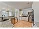 Spacious kitchen with stainless steel appliances, granite counters, and tile flooring at 212 Sunset Hills Dr, Norcross, GA 30071