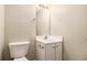 Cozy half-bath with a white vanity, modern fixtures, and a clean, simple design at 256 Coral Cir, Mcdonough, GA 30253