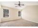 Bright bedroom with a large window, neutral carpet, and vaulted ceiling, creating a serene and comfortable atmosphere at 256 Coral Cir, Mcdonough, GA 30253