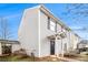 Side view of home, highlighting vinyl siding, black shutters and trim, well-maintained lawn, and inviting curb appeal at 256 Coral Cir, Mcdonough, GA 30253