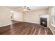 Inviting living room featuring a cozy fireplace, wood flooring, and ample natural light, perfect for relaxation at 256 Coral Cir, Mcdonough, GA 30253