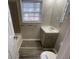 Bathroom featuring a vanity, window and tiled shower/tub at 2827 Vicksburg Ct, Decatur, GA 30034