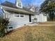 Cozy light grey home with dormer windows and a convenient attached garage at 2827 Vicksburg Ct, Decatur, GA 30034