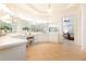 Large bathroom with a vanity, mirrors, and a doorway leading to the bedroom at 765 Glengate Pl, Atlanta, GA 30328
