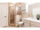 Bathroom featuring a glass-enclosed shower and vanity with a white sink at 765 Glengate Pl, Atlanta, GA 30328