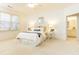 Bright bedroom featuring neutral decor, comfortable bedding, and ample natural light, creating a serene and inviting space at 765 Glengate Pl, Atlanta, GA 30328