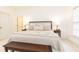 Bright bedroom features plush bedding, neutral decor, and dark wood furniture at 765 Glengate Pl, Atlanta, GA 30328