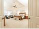 Spacious bedroom with a ceiling fan, tray ceiling, and a large window at 765 Glengate Pl, Atlanta, GA 30328