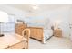 Bright bedroom features natural wood furniture, carpet, and lots of natural light at 765 Glengate Pl, Atlanta, GA 30328