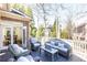Charming deck with outdoor seating and peaceful wooded view at 765 Glengate Pl, Atlanta, GA 30328