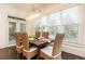 Bright dining room with large windows, stylish light fixture, and seating for six at 765 Glengate Pl, Atlanta, GA 30328