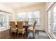 Bright dining room with modern chandelier, large windows, and access to outdoor patio at 765 Glengate Pl, Atlanta, GA 30328