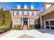 Charming two-story brick home with black shutters, dormer windows, and a manicured front yard for curb appeal at 765 Glengate Pl, Atlanta, GA 30328