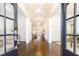 Elegant foyer featuring dark wood floors, detailed trim, and modern pendant lighting at 765 Glengate Pl, Atlanta, GA 30328