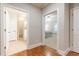 Hallway view with open doorways to a bathroom and a bedroom at 765 Glengate Pl, Atlanta, GA 30328