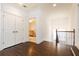 Bright upstairs hallway with hardwood floors, a linen closet, and natural light from the nearby bedroom at 765 Glengate Pl, Atlanta, GA 30328