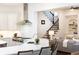 Spacious kitchen with stainless steel range and hood flowing into Gathering room and stairway at 765 Glengate Pl, Atlanta, GA 30328