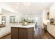 Gourmet kitchen featuring a center island with bar seating, stainless steel appliances and modern design at 765 Glengate Pl, Atlanta, GA 30328