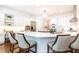 Spacious kitchen features white cabinets, stainless steel appliances, and a large island with bar seating at 765 Glengate Pl, Atlanta, GA 30328