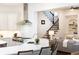Open-concept kitchen with stainless steel appliances that flows into the living room and stairs at 765 Glengate Pl, Atlanta, GA 30328