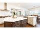 Gourmet kitchen featuring a center island with bar seating and stainless steel appliances at 765 Glengate Pl, Atlanta, GA 30328