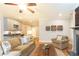Inviting living room with hardwood floors, a fireplace, and an open floor plan into the kitchen at 765 Glengate Pl, Atlanta, GA 30328