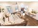 Open living room with a fireplace, hardwood floors, comfortable seating, and abundant natural light, creating an inviting atmosphere at 765 Glengate Pl, Atlanta, GA 30328