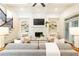 Cozy living room with fireplace, built-in shelving, comfortable seating, and coffered ceilings at 765 Glengate Pl, Atlanta, GA 30328