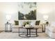Bright living room features neutral furniture, elegant decor, and a striking nature-inspired painting at 765 Glengate Pl, Atlanta, GA 30328