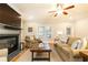 The living room features a fireplace, flatscreen tv, wood floors, and neutral decor at 765 Glengate Pl, Atlanta, GA 30328