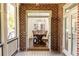 View from the patio into the dining room featuring brick accents and lots of light at 765 Glengate Pl, Atlanta, GA 30328