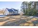 Large backyard with mature trees at 857 Winding Trl, Lawrenceville, GA 30046