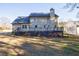 The back of the house shows the deck and expansive backyard at 857 Winding Trl, Lawrenceville, GA 30046
