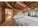 Unfinished basement with exposed wood framing, ready for customization at 857 Winding Trl, Lawrenceville, GA 30046