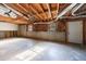 Unfinished basement with concrete floor and exposed ceiling at 857 Winding Trl, Lawrenceville, GA 30046